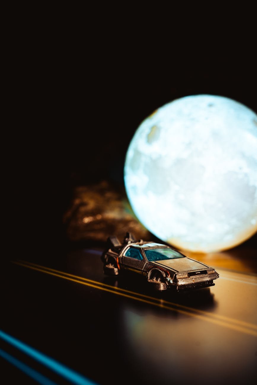 flying delorean time machine from back to the future next to a full moon lamp